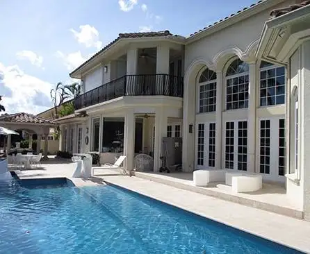 a-mansion-with-hurricane-impact-windows-and-doors a big house with hurricane windows and doors